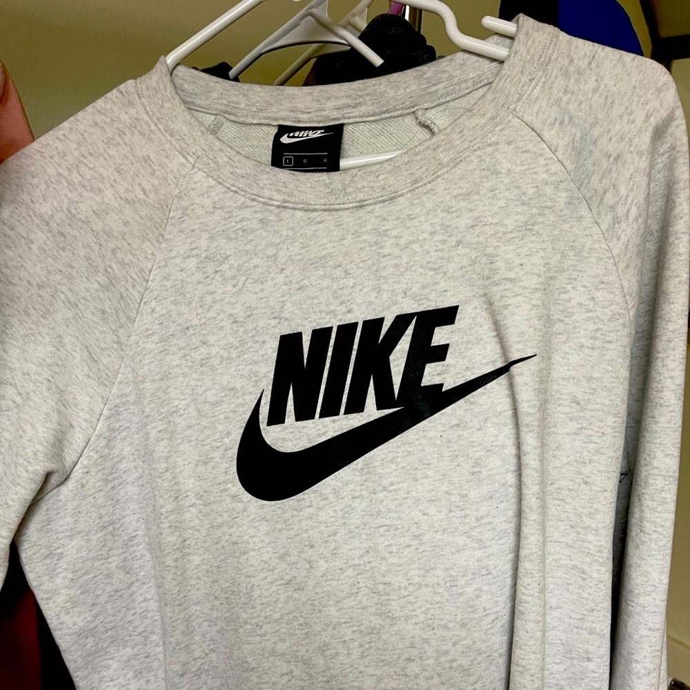 Woman’s Nike sweatshirt.